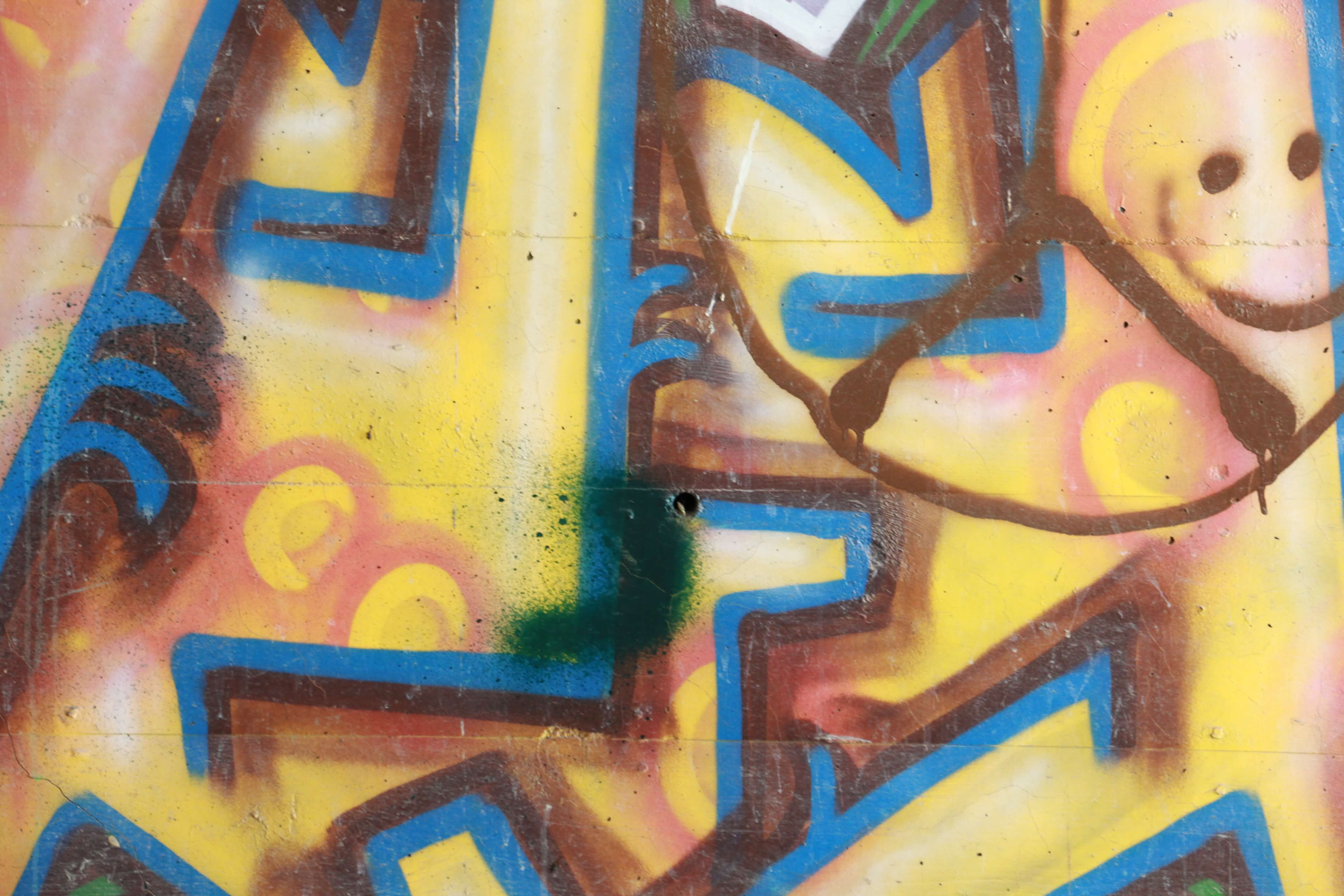 Yellow Blue Spray Paint Graffiti On Wall Texture X